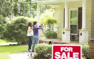 Homeowners looking at a house